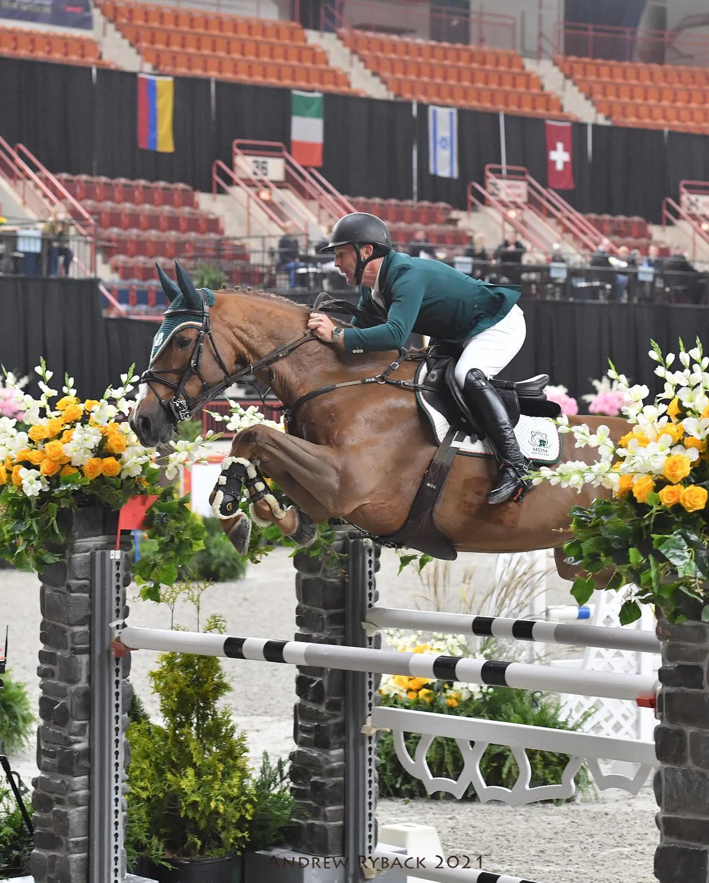 Grand Prix hunter Ballinteskin Joe jumping a fence in Florida